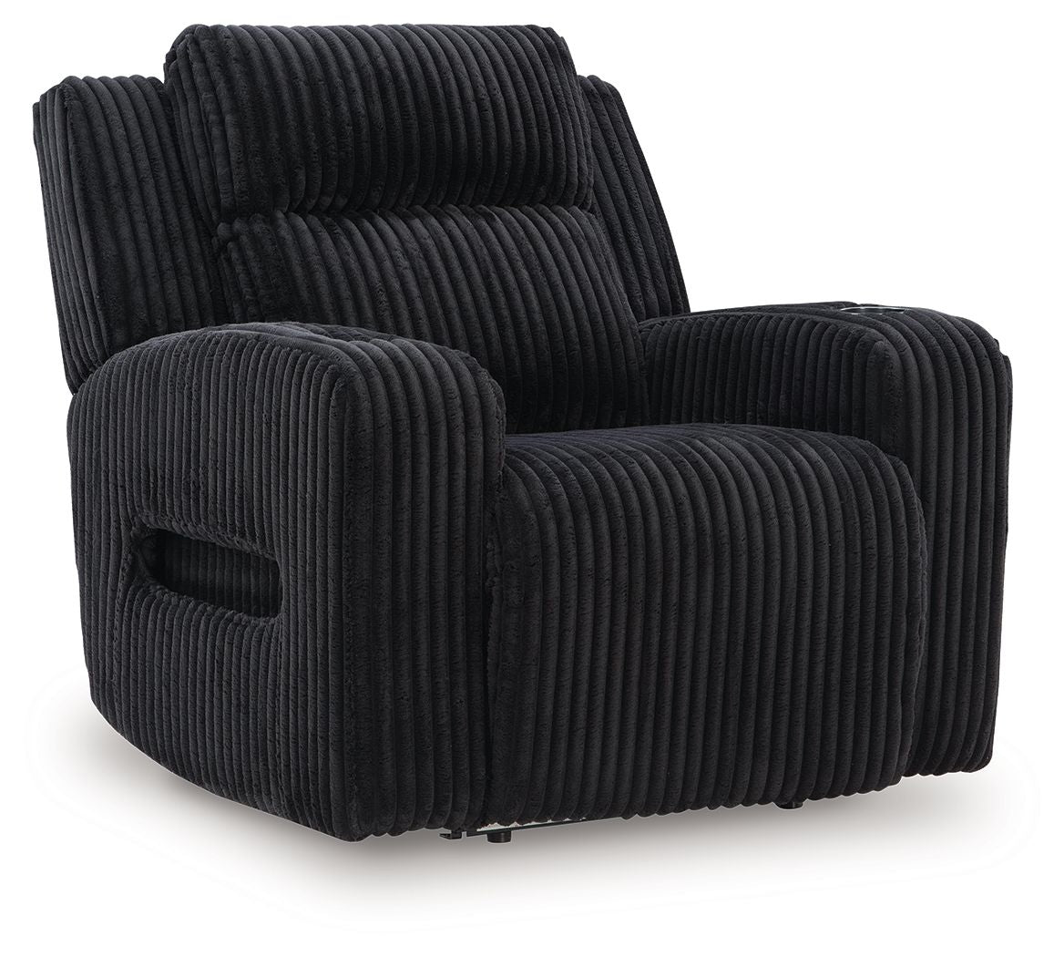 Black corduroy recliner with adjustable headrest and padded armrests