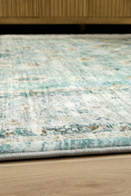 Ladstoney rug close-up with distressed blue lines and light speckled background