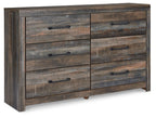 Rustic wood dresser close-up with six drawers and black bar handles in gray-brown finish