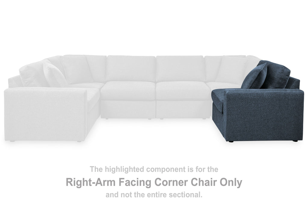 Dark navy upholstered corner chair with right-facing armrest