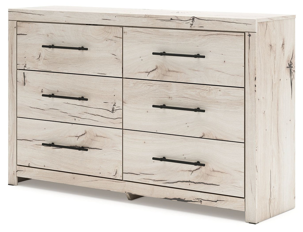 Light natural six-drawer dresser with six drawers and black bar pulls, three-quarter front view.