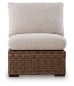 Beige armless chair cushion with dark brown woven wicker base