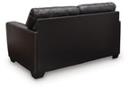 Dark leather-look loveseat with squared arms and upholstered back cushions