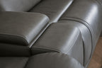 Dark gray power reclining sofa armrest and seat cushion with visible stitching