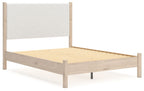 Beige upholstered panel bed with light wood frame and exposed wooden slats