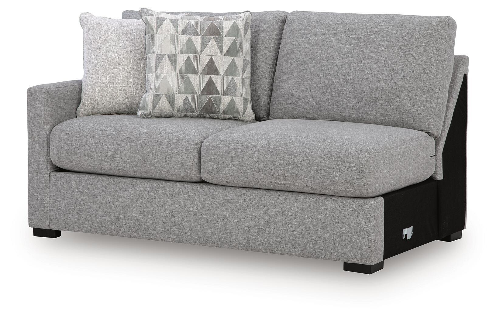 Pewter gray sofa with patterned lumbar pillow and beige accent cushion, squared arms