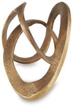 Antique brass metal sculpture with stacked oval rings, abstract intertwined design