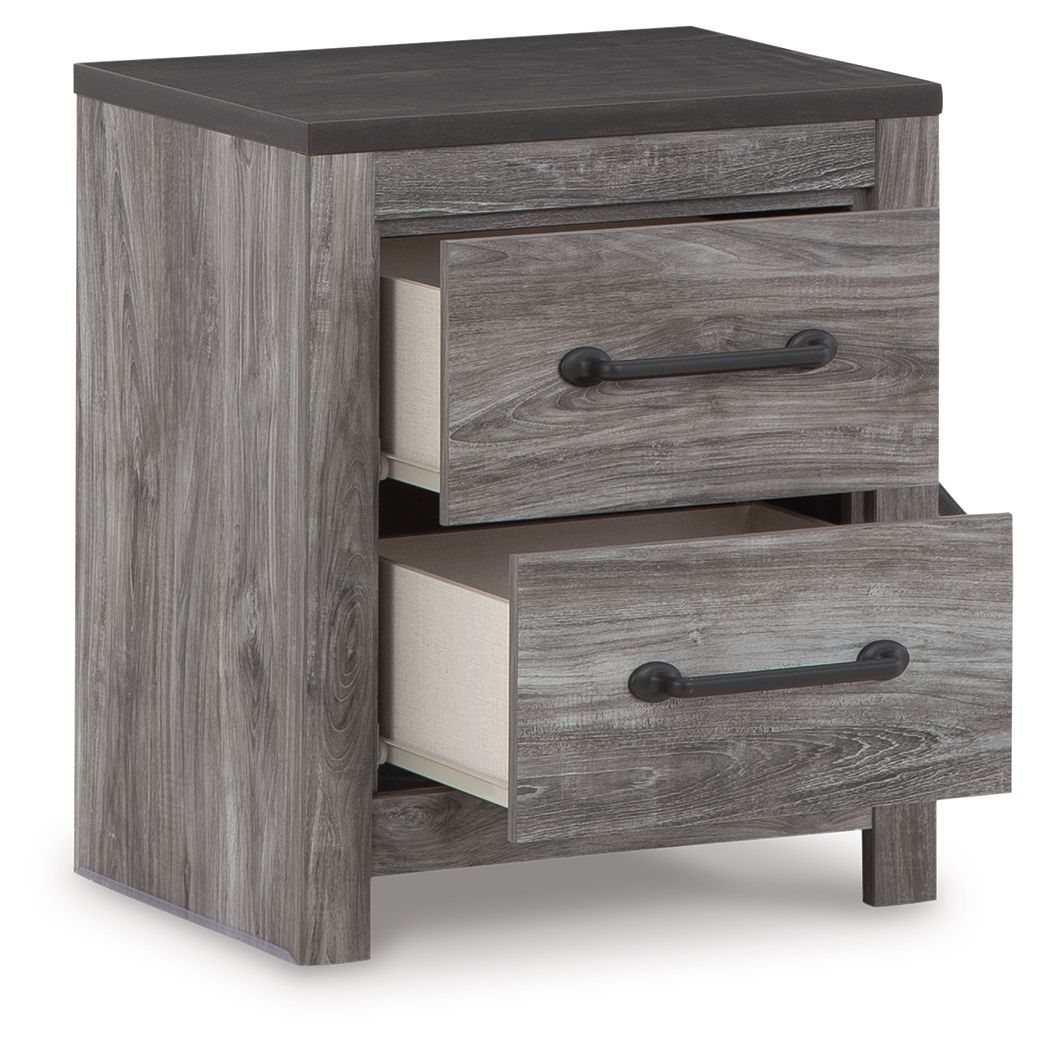 Two-drawer night stand with one drawer open, gray woodgrain and black metal pulls.