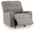 Iron fabric rocker recliner with tufted back and flip-up footrest, side view