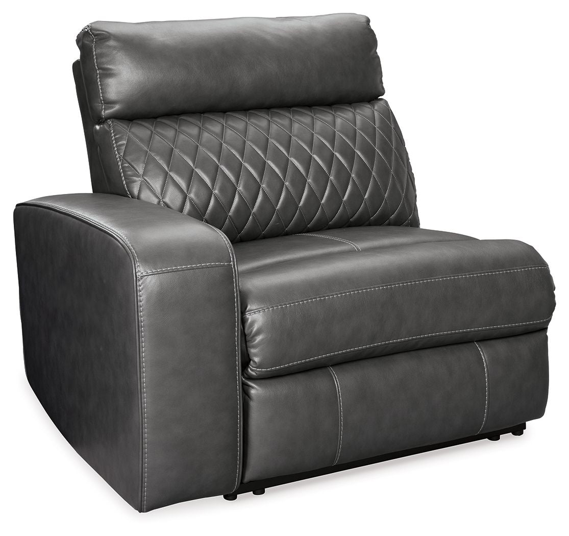 Gray power recliner chair, quilted backrest and smooth seat with footrest extended