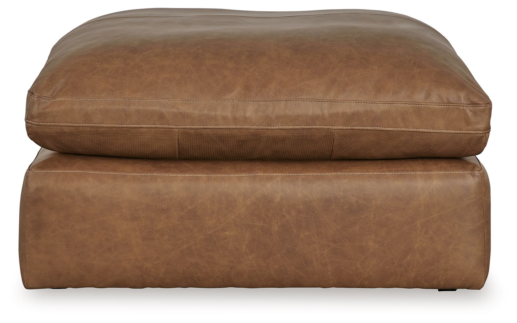 Light brown oversized accent ottoman with rounded top, stitched edges, and low base