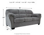 Pewter gray fabric sofa with tufted cushions and studded trim along arms