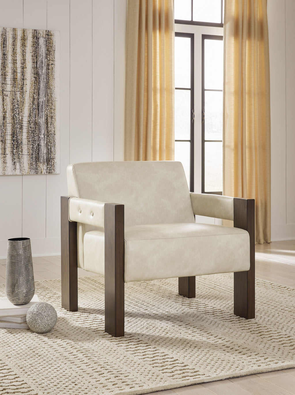 Beige accent chair with dark wood arms and button-tufted upper backrest