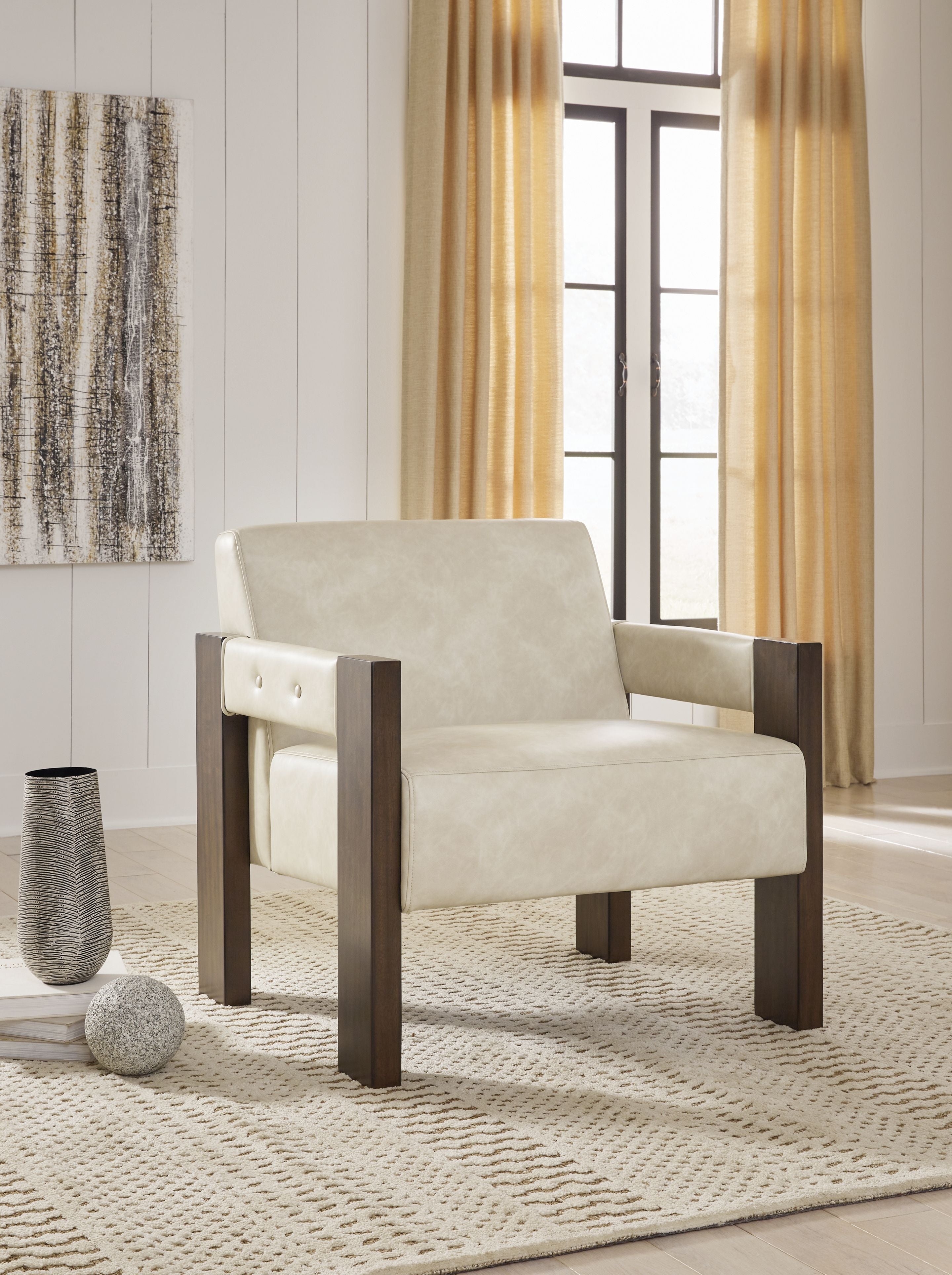 Beige accent chair with dark wood arms and button-tufted upper backrest