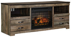 Brown wood TV stand with glass-front fireplace insert and open shelving