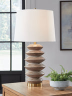 Poly table lamp with white shade, stacked brown sections, and gold stem