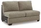 Beige armless full sleeper with two back cushions and padded seat, textured upholstery