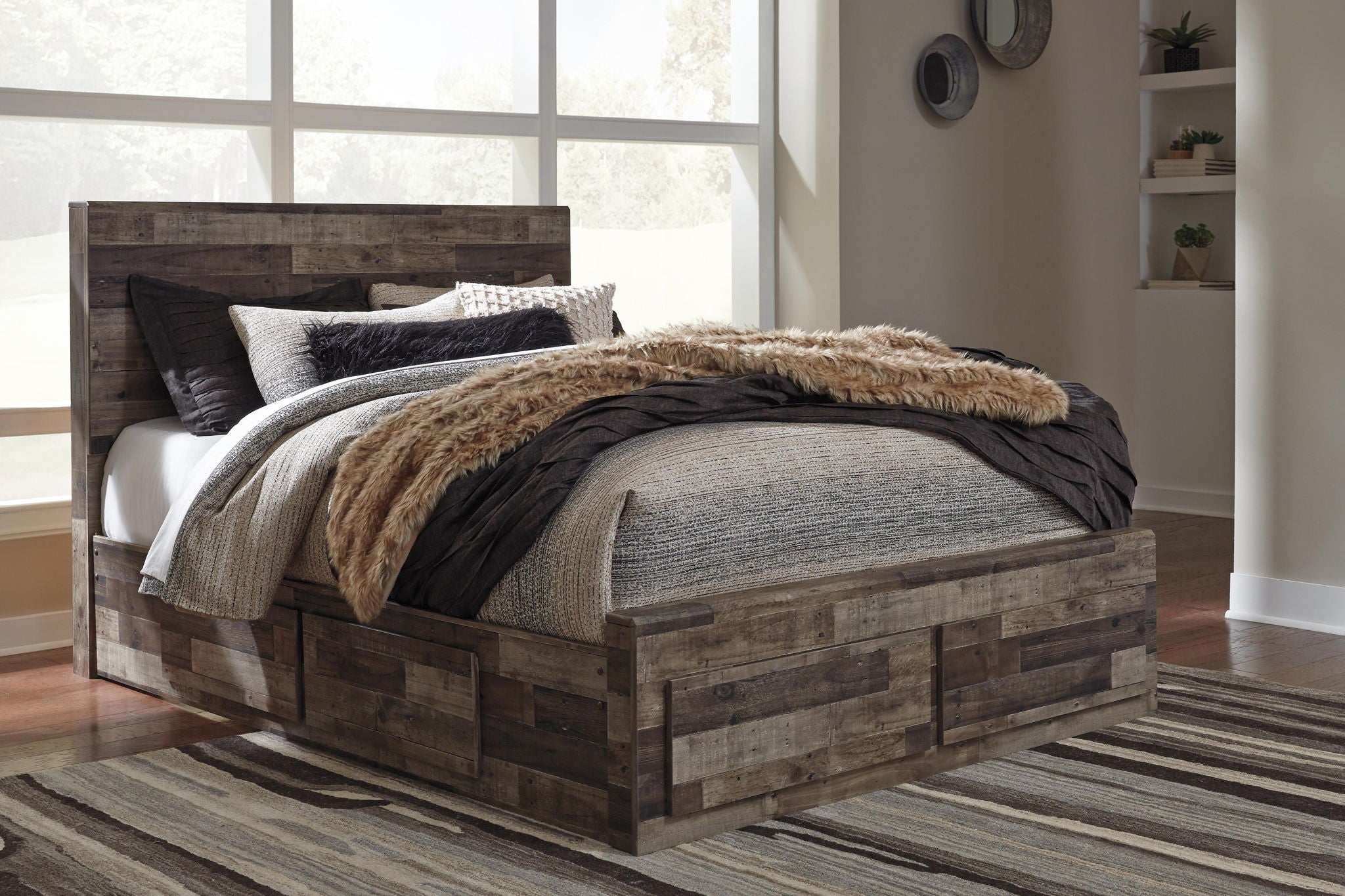 Rustic panel bed with dark wood frame, gray bedding, black blanket, and tan fur throw