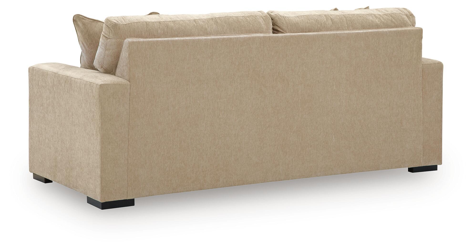 Sofa sleeper in light tan fabric, squared arms, and low black feet
