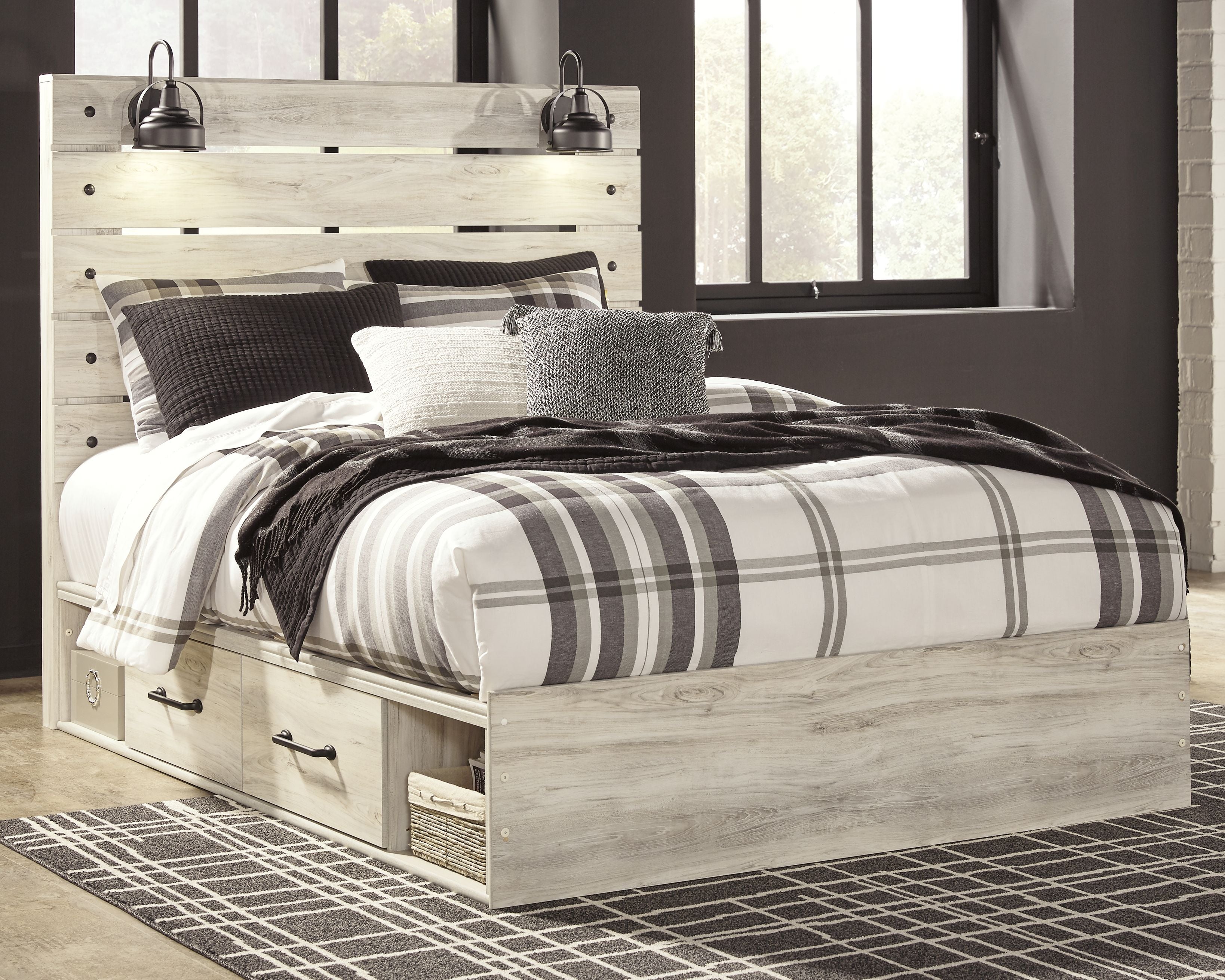 Light wood bed with plaid bedding and openwork headboard, with drawer nightstand