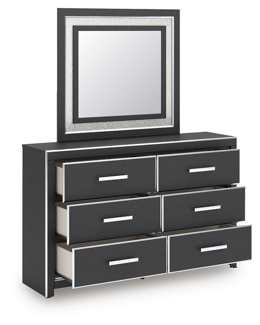 Black dresser with six drawers and square framed mirror, angled view