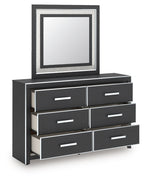 Black dresser with six drawers and square framed mirror, angled view