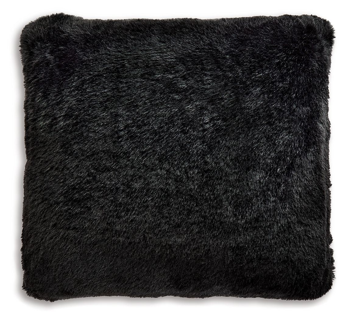 Black faux fur pillow, square close-up with plush shag texture.