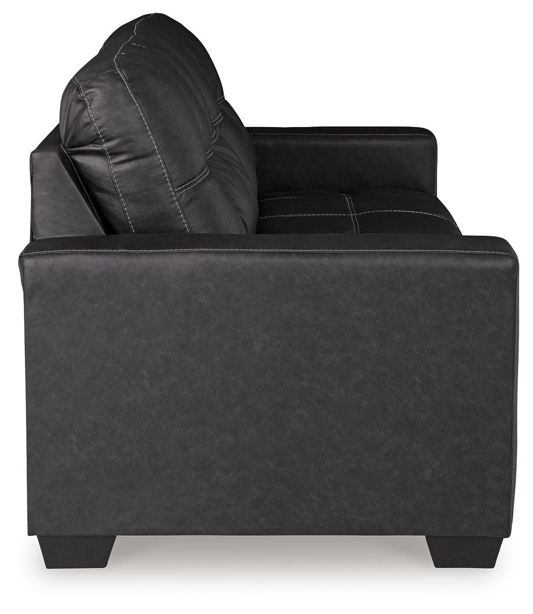 Black leather-look recliner chair with tufted back and rolled arm, square seat