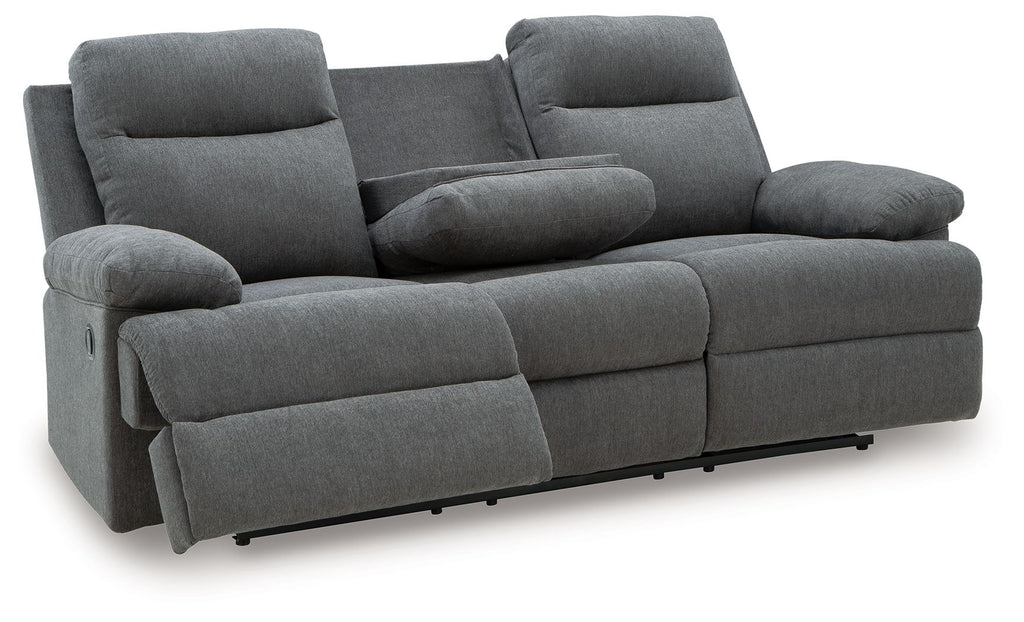 Dark gray reclining sofa with cup-style armrests and segmented back cushions