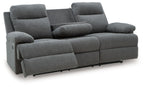 Dark gray reclining sofa with cup-style armrests and segmented back cushions