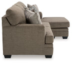 Dark brown fabric sofa with rolled arms, box seat, and two accent pillows