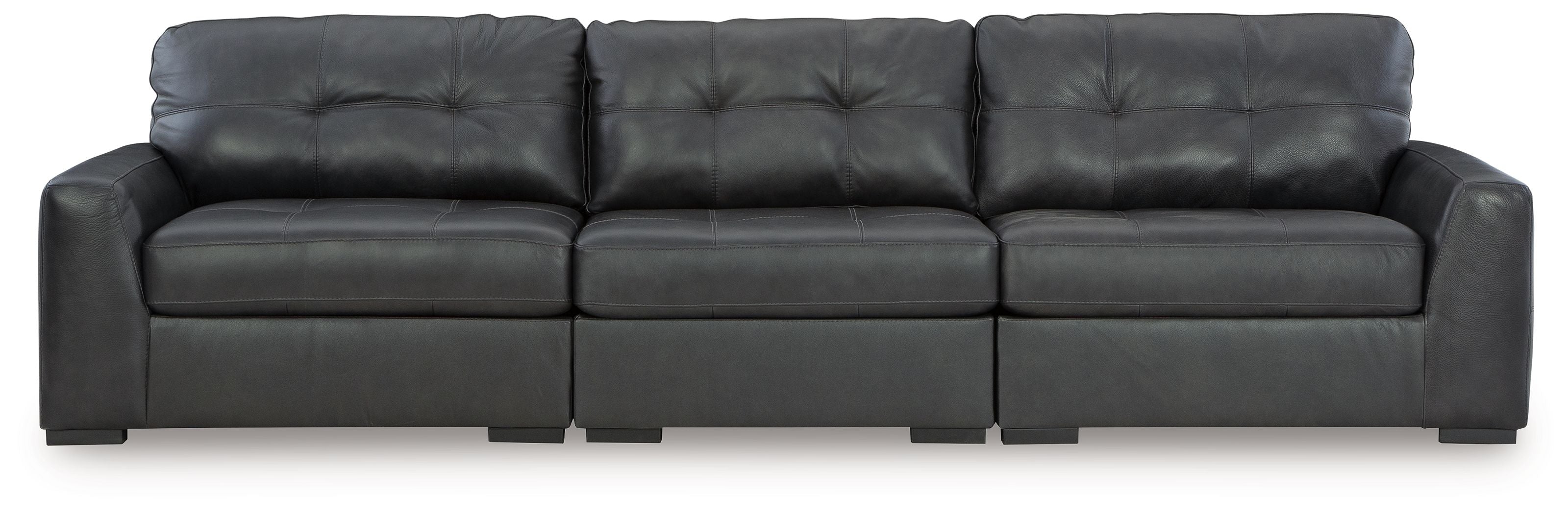 Three-seat sectional sofa with tufted back and squared seat cushions in dark fabric