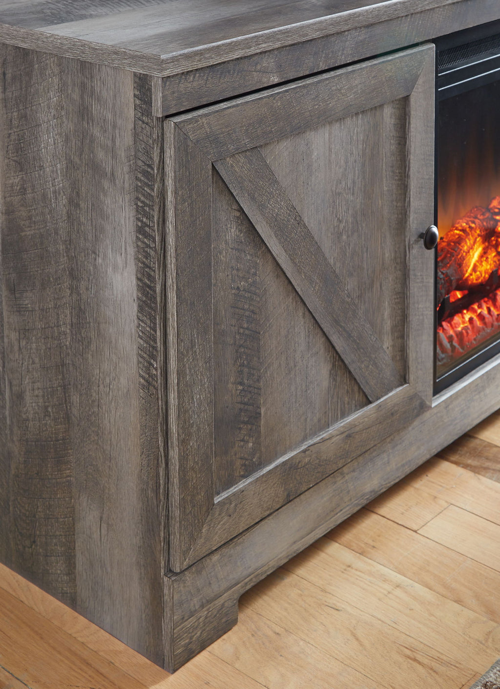 Gray cabinet door front with diagonal panel detail and glass fireplace opening