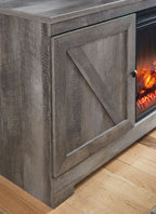 Gray cabinet door front with diagonal panel detail and glass fireplace opening