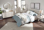 Bedroom furniture set with bed, dresser, and nightstand pieces in light finishes