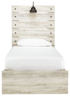 Light beige panel bed with slatted headboard, round knobs, and upholstered mattress