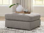 Smoke gray oversized accent ottoman with upholstered seat and square base