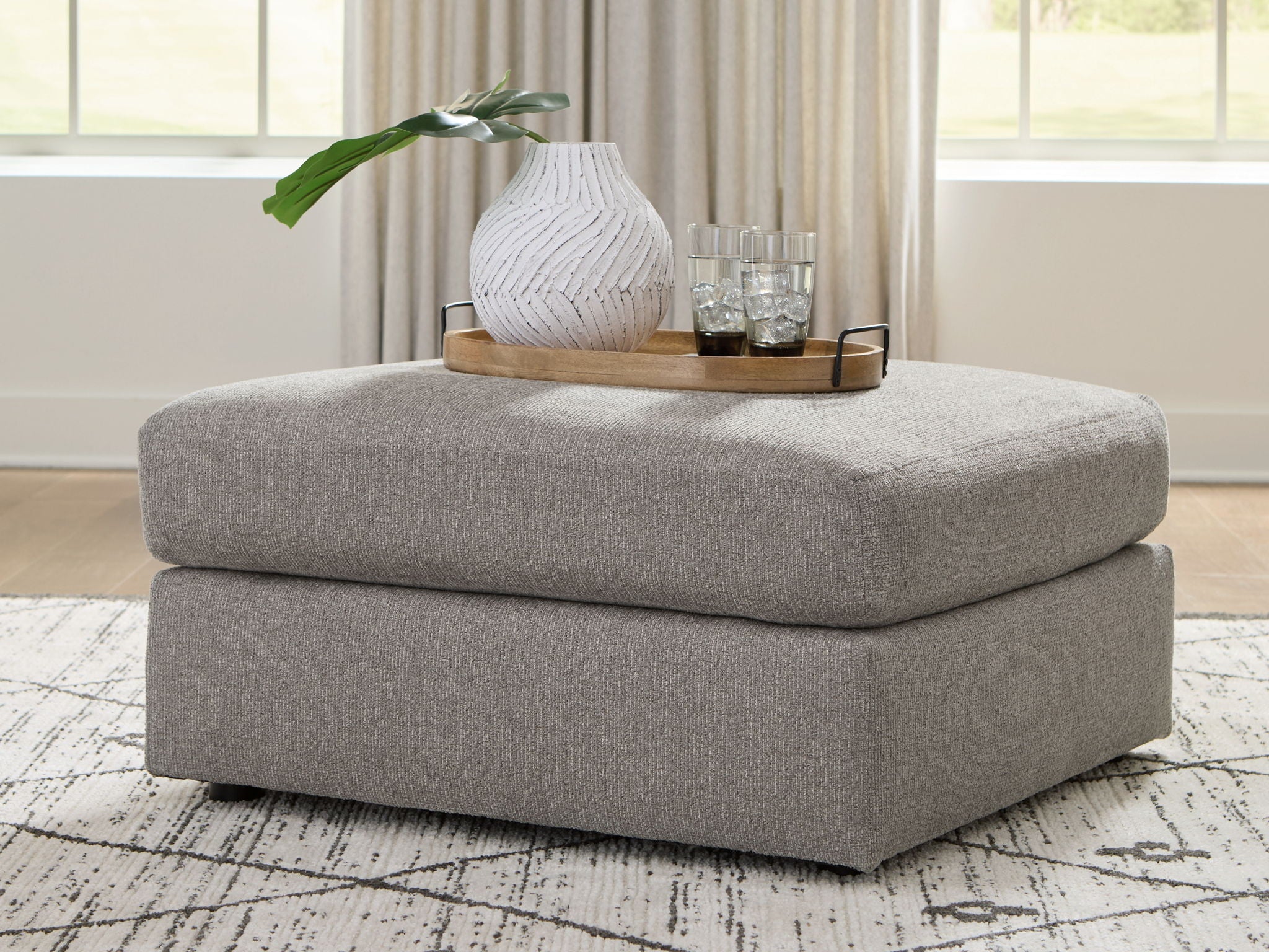 Smoke gray oversized accent ottoman with upholstered seat and square base