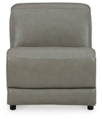 Gray armless upholstered chair with front curved base and stitched trim