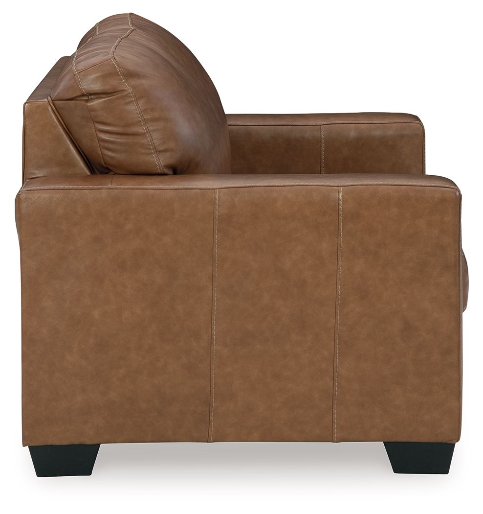 Light brown loveseat sofa with rolled back cushion and padded seat, dark feet