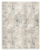 Cream abstract area rug with blue-gray distressed pattern and textured pile.