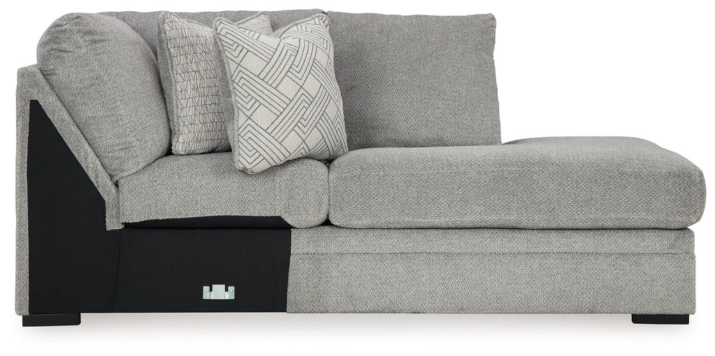 Cement gray corner chaise sofa with patterned back cushion and black end panel