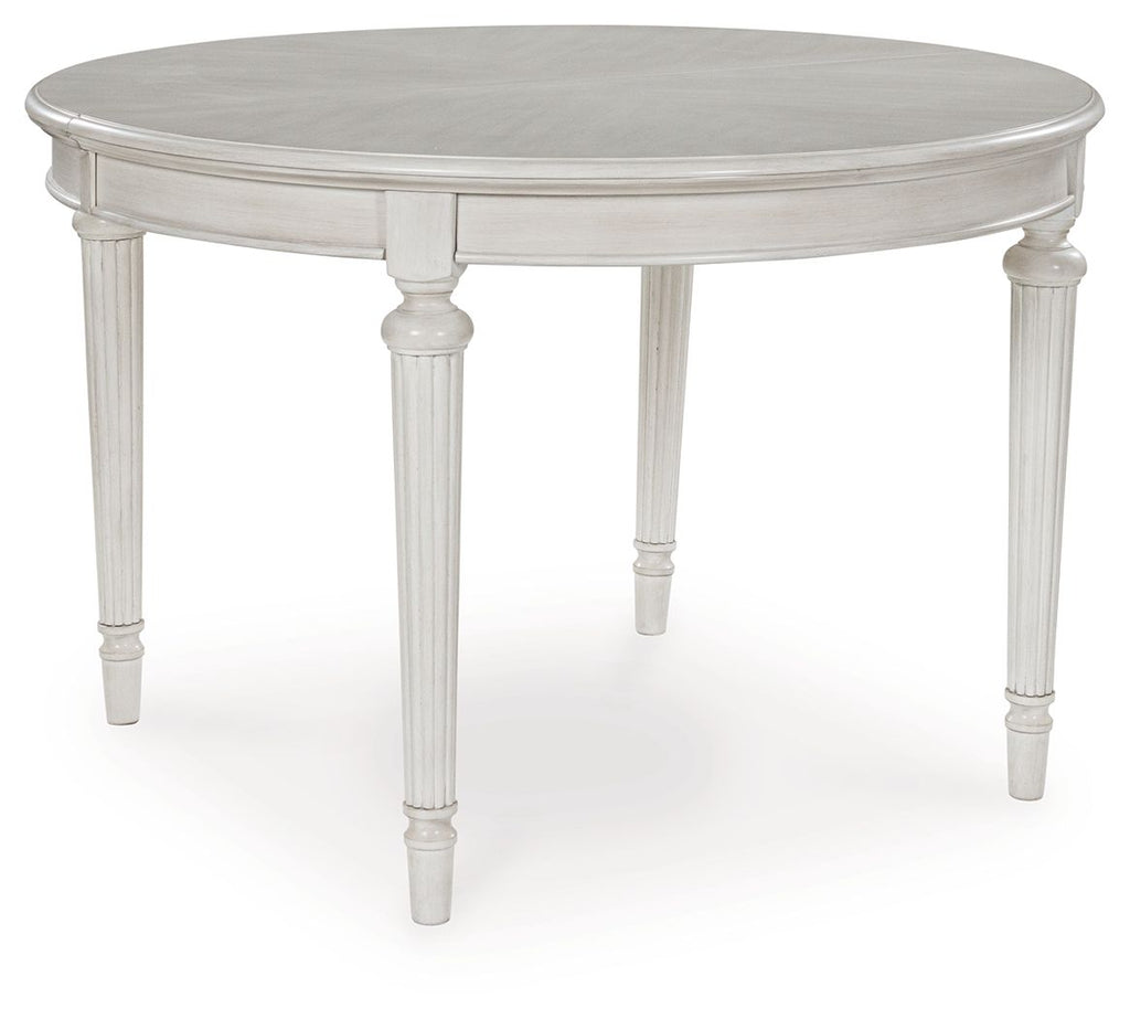 Antique white oval dining extension table with pedestal base and routed trim