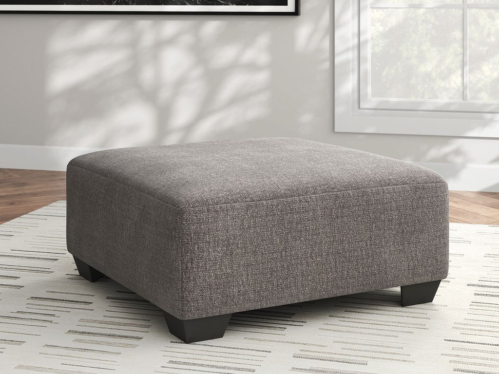 Square upholstered ottoman in heathered gray with low dark legs