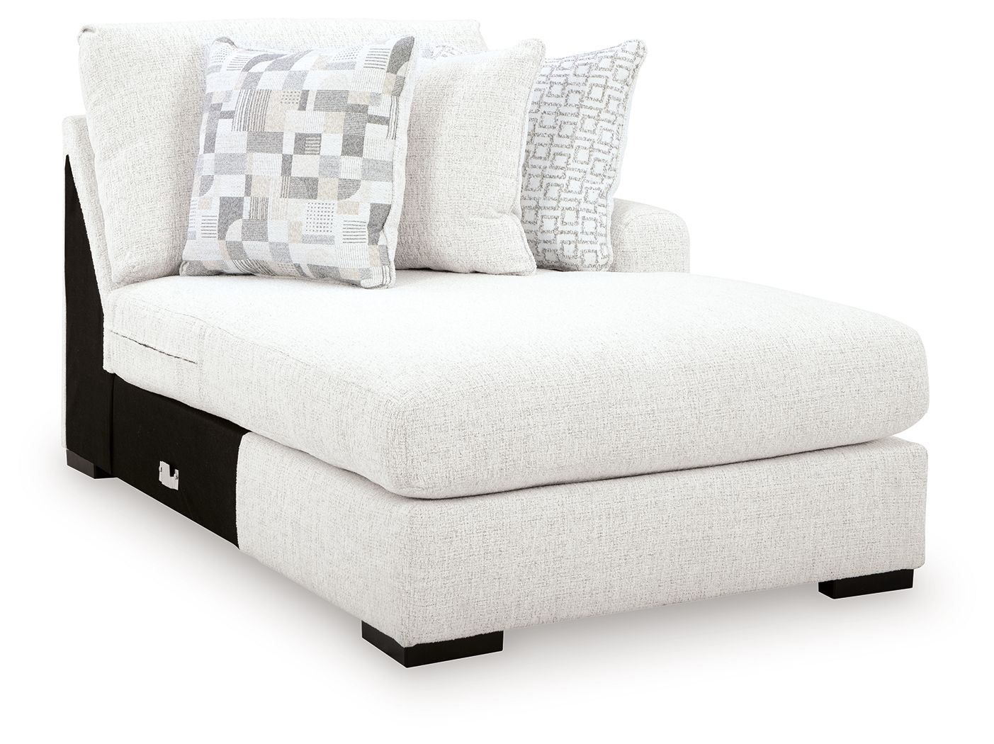 Corner chaise lounge in chalk fabric with patterned throw pillows and black legs