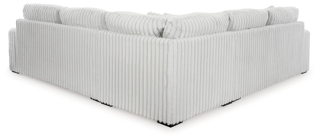 Gray sectional sofa chaise with ribbed fabric and tufted back cushion detail