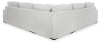 Gray sectional sofa chaise with ribbed fabric and tufted back cushion detail