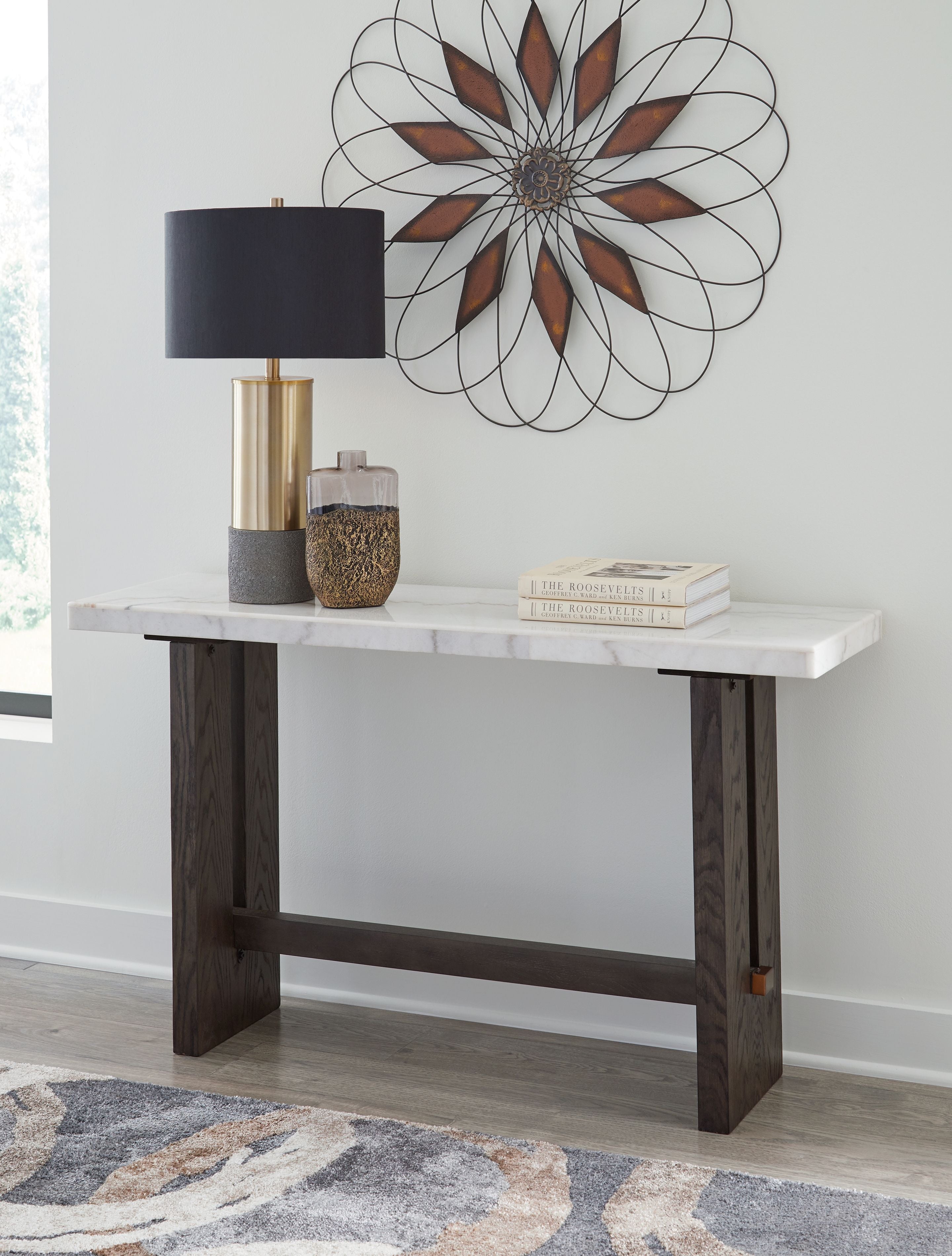 White marble sofa table with dark brown wood legs and open center apron