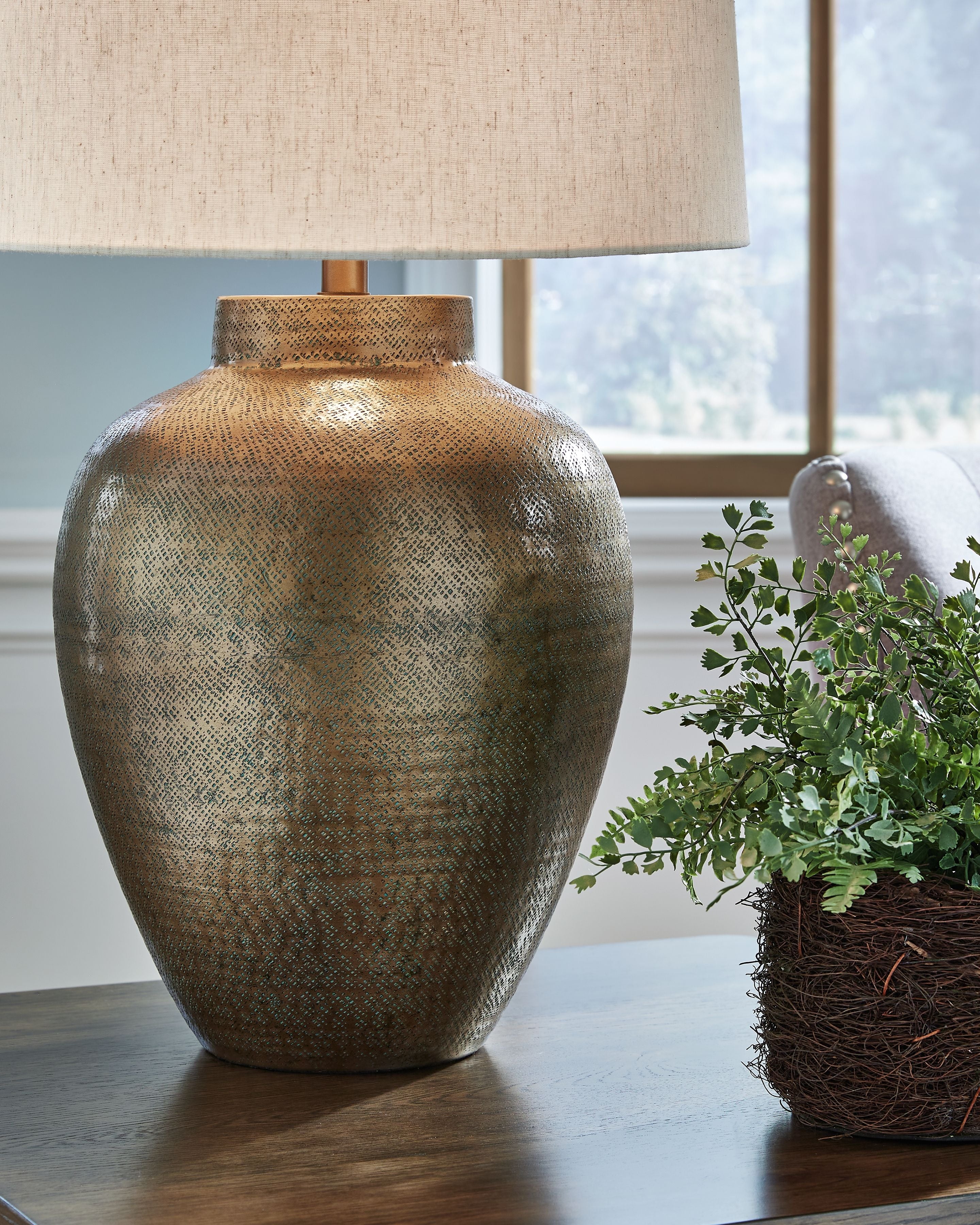 Antique gold metal table lamp base with beige drum fabric shade