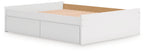 White platform bed with open slat base and storage drawer fronts